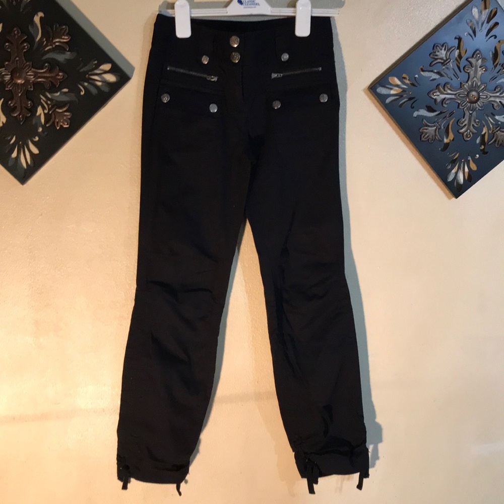 Black pants with gold buttons